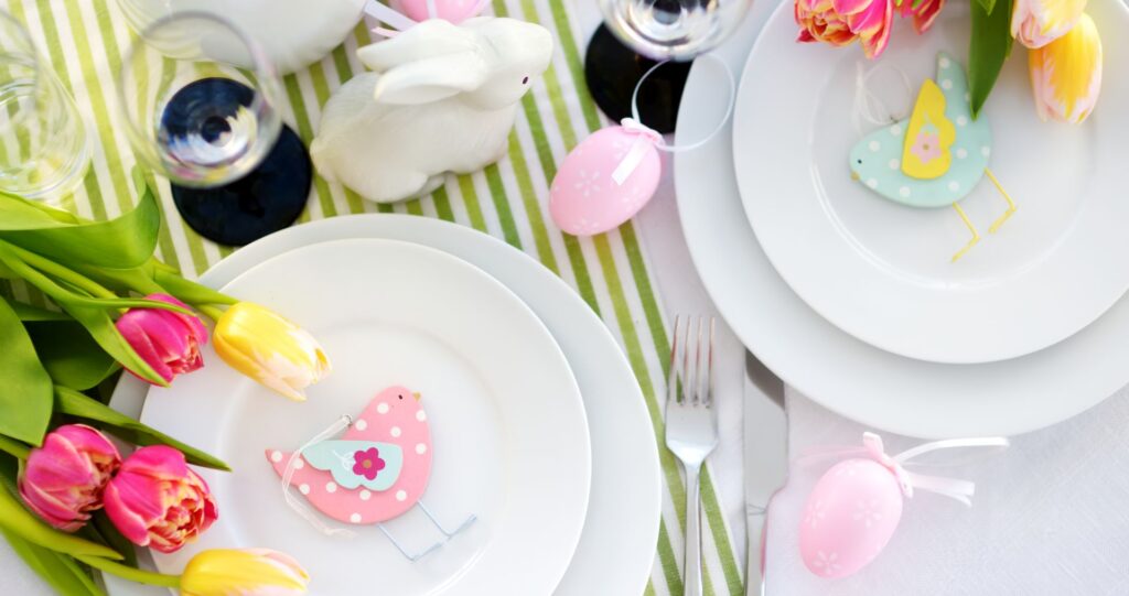 Beautiful table setting with crockery and flowers for Easter celebration